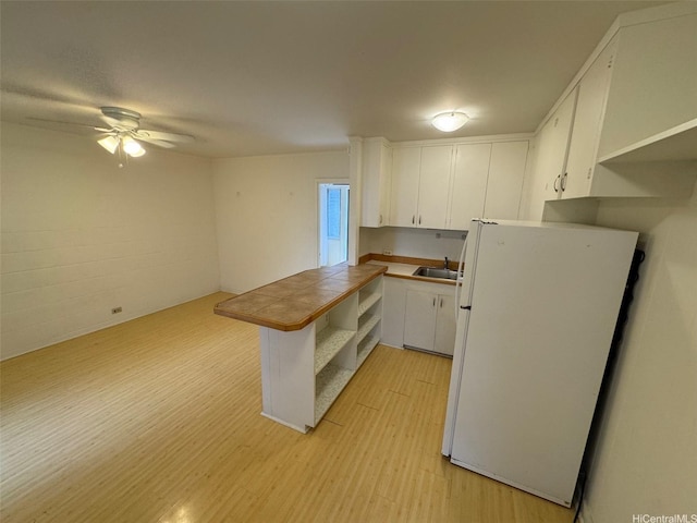 1617 Miller St Unit 3, Honolulu, HI 96813 - kitchen with freestanding refrigerator, light wood-style flooring, white cabinets, open shelves, and tile countertops