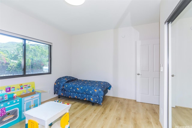 bedroom with light wood-style floors
