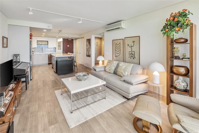 1200 Queen Emma St Unit 3610, Honolulu, HI 96813 - living room with a wall unit AC, light wood-style flooring, and track lighting