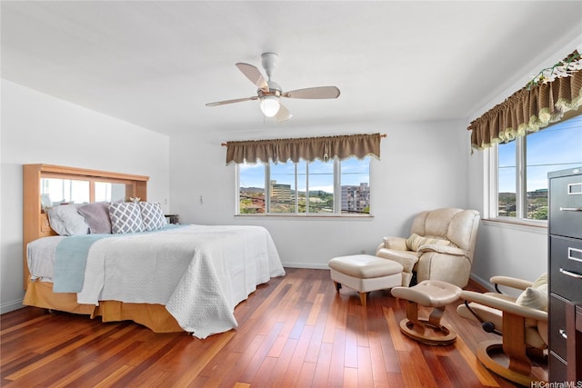 99-060 Nalopaka Pl, Aiea, HI 96701 - bedroom with multiple windows, wood finished floors, and a ceiling fan