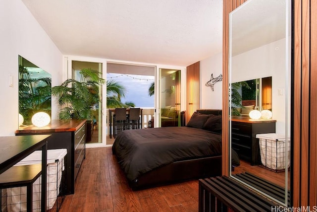 84-965 Farrington Hwy Unit A502, Waianae, HI 96792 - bedroom featuring dark wood-style floors and access to outside