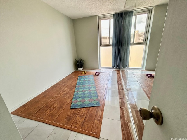 1624 Kanunu St Unit 1208, Honolulu, HI 96814 - spare room with a textured ceiling and baseboards