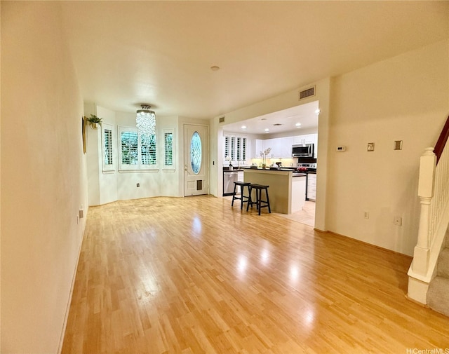 7018 Hawaii Kai Dr Unit 6-12, Honolulu, HI 96825 - living room featuring light wood-style floors