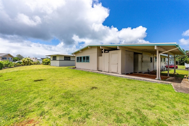 45-155 Pahikoli Pl, Kaneohe, HI 96744 - rear view of property featuring a lawn