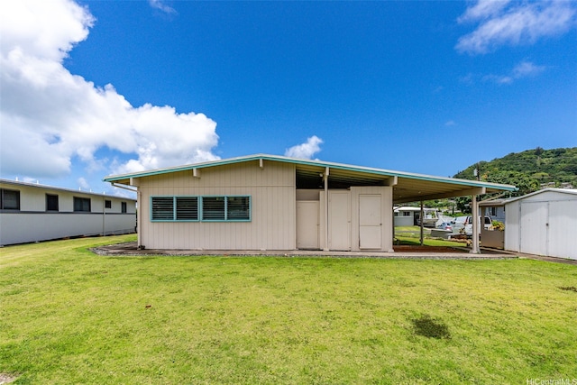 45-155 Pahikoli Pl, Kaneohe, HI 96744 - back of house with a yard and an attached carport