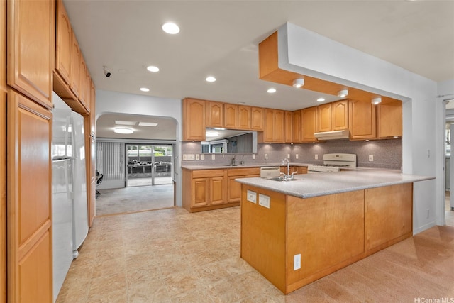 45-155 Pahikoli Pl, Kaneohe, HI 96744 - kitchen featuring white gas range, under cabinet range hood, light countertops, a sink, and backsplash