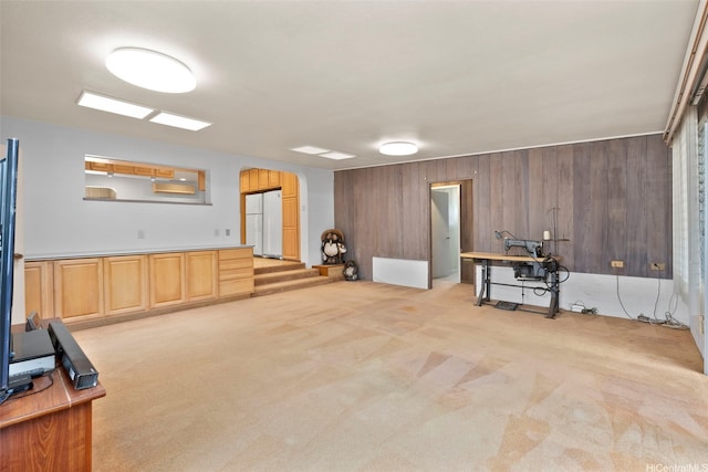 45-155 Pahikoli Pl, Kaneohe, HI 96744 - below grade area featuring light carpet, freestanding refrigerator, wood walls, and arched walkways
