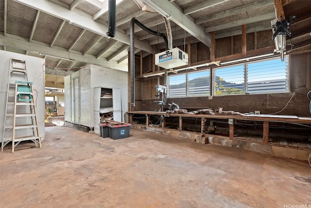 45-155 Pahikoli Pl, Kaneohe, HI 96744 - misc room featuring unfinished concrete floors, a workshop area, and a heating unit