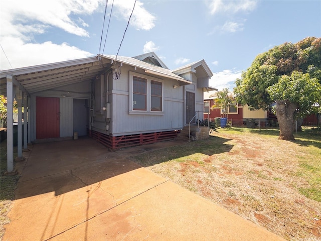 3140 Paliuli St, Honolulu, HI 96816 - view of front of home with concrete driveway, an attached carport, and entry steps