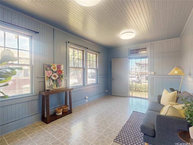 3140 Paliuli St, Honolulu, HI 96816 - sitting room featuring wood walls, baseboards, wood ceiling, and light floors