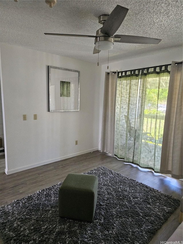 94-209 Paioa Pl Unit L 205, Waipahu, HI 96797 - empty room featuring wood finished floors, a ceiling fan, baseboards, and a textured ceiling