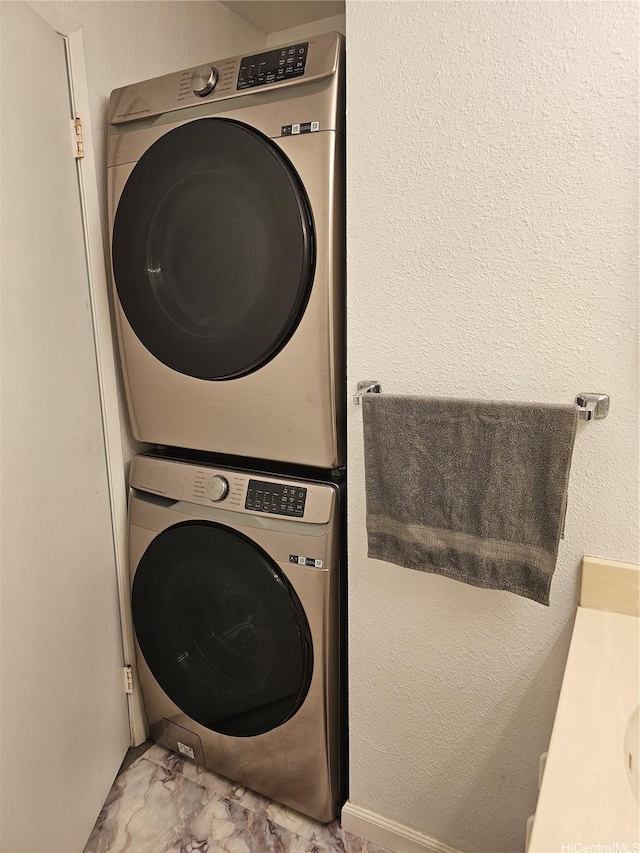 94-209 Paioa Pl Unit L 205, Waipahu, HI 96797 - washroom featuring stacked washer / dryer and marble finish floors