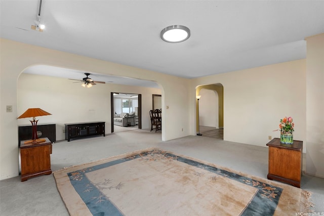 98-042 Puaalii Way, Aiea, HI 96701 - unfurnished living room with arched walkways, carpet, and a ceiling fan