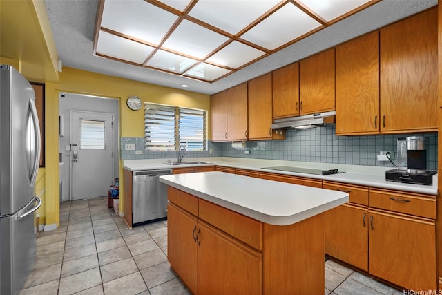 98-042 Puaalii Way, Aiea, HI 96701 - kitchen with stainless steel appliances, under cabinet range hood, backsplash, and light countertops