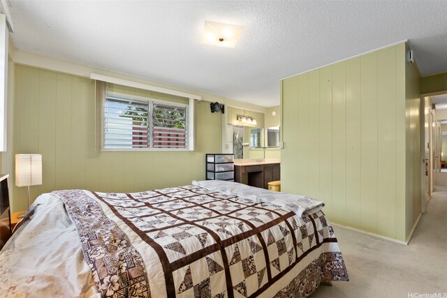 98-042 Puaalii Way, Aiea, HI 96701 - carpeted bedroom featuring ensuite bathroom and a textured ceiling