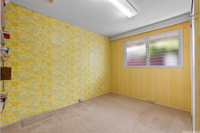 98-042 Puaalii Way, Aiea, HI 96701 - unfurnished room with carpet and a textured ceiling