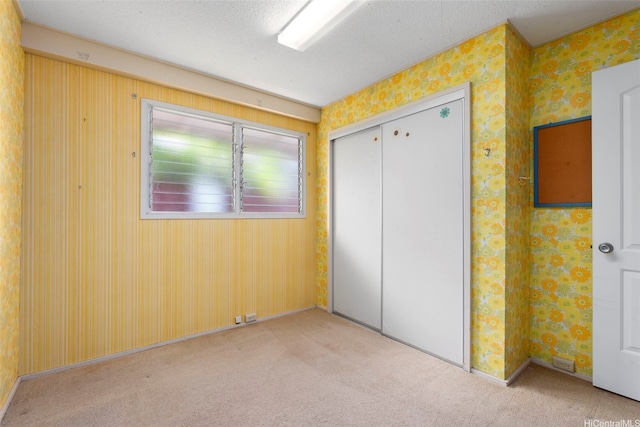 98-042 Puaalii Way, Aiea, HI 96701 - unfurnished bedroom with carpet flooring, wallpapered walls, a closet, and baseboards
