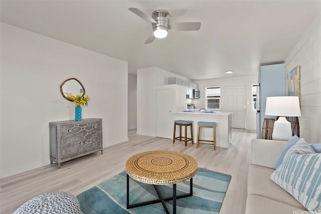 1210 Hooli Cir, Pearl City, HI 96782 - living area featuring light wood-type flooring, a ceiling fan, and baseboards