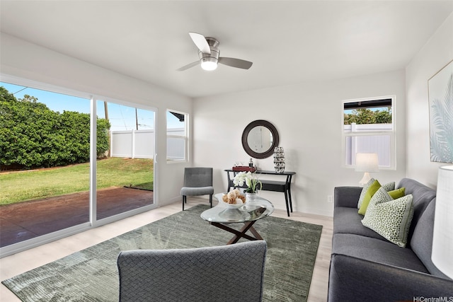 1210 Hooli Cir, Pearl City, HI 96782 - living area featuring healthy amount of natural light, a ceiling fan, and wood finished floors