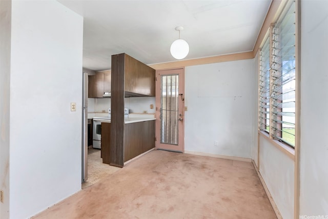 95-456 Kaelo Pl, Mililani, HI 96789 - kitchen with white electric range, light colored carpet, light countertops, under cabinet range hood, and pendant lighting