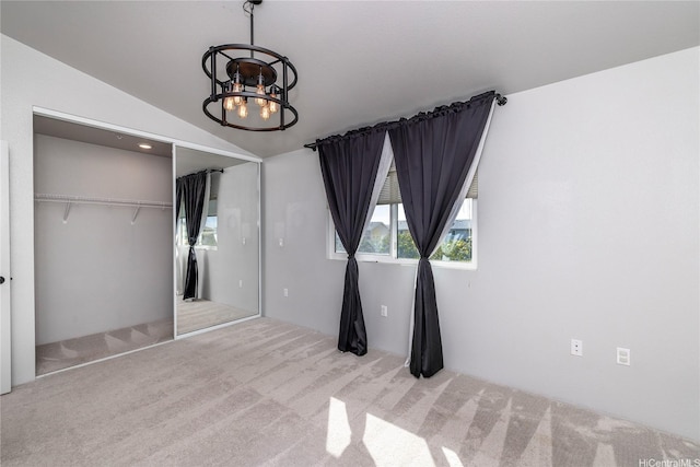 91-3617 Kamolehonua St Unit 613, Ewa Beach, HI 96706 - unfurnished bedroom featuring carpet floors, a chandelier, a closet, and vaulted ceiling