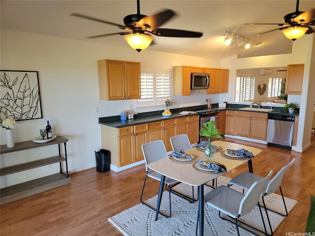 91-1565 Wahane St, Kapolei, HI 96707 - kitchen featuring appliances with stainless steel finishes, a ceiling fan, healthy amount of natural light, and vaulted ceiling