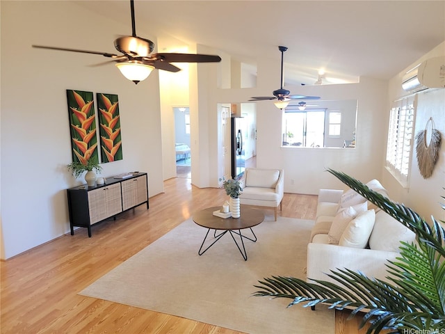 91-1565 Wahane St, Kapolei, HI 96707 - living room with ceiling fan, lofted ceiling, wood finished floors, and a wall mounted air conditioner