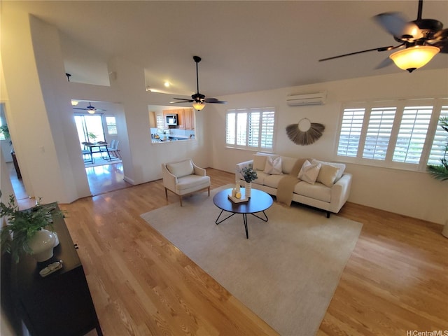 91-1565 Wahane St, Kapolei, HI 96707 - living area featuring a ceiling fan, light wood-type flooring, a wall mounted air conditioner, and lofted ceiling