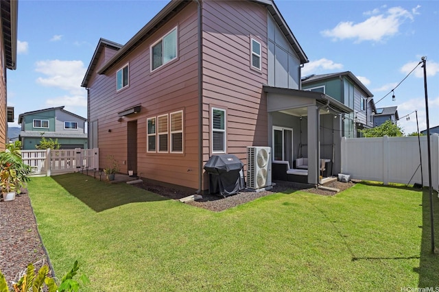 91-1640 Honouliuli St Unit 109, Ewa Beach, HI 96706 - back of house featuring a cooling unit and a sunroom