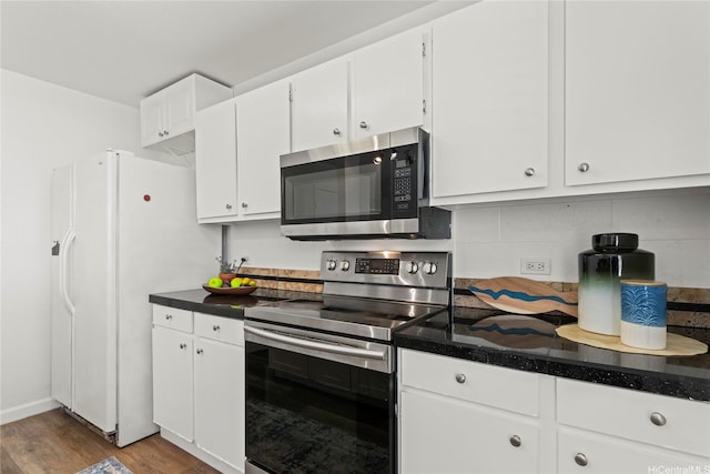 92-1132 Panana St Unit 130, Kapolei, HI 96707 - kitchen with appliances with stainless steel finishes, white cabinetry, wood finished floors, and backsplash
