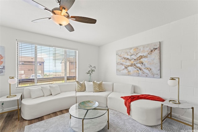 92-1132 Panana St Unit 130, Kapolei, HI 96707 - living room featuring healthy amount of natural light, wood finished floors, ceiling fan, and baseboards