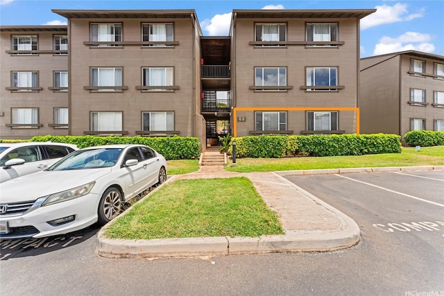 92-1132 Panana St Unit 130, Kapolei, HI 96707 - view of building exterior featuring uncovered parking