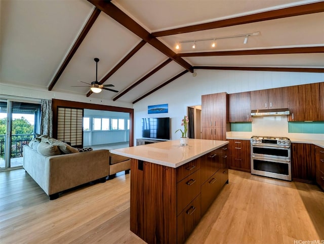 82-6148 Hoomaka Pl, Captain Cook, HI 96704 - kitchen with double oven range, under cabinet range hood, light wood-type flooring, and light countertops