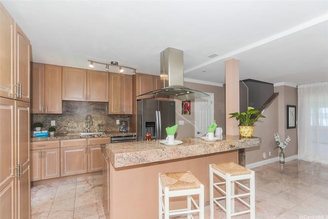 205 Koko Isle Cir Unit 403, Honolulu, HI 96825 - kitchen featuring stainless steel fridge, a sink, island exhaust hood, a kitchen bar, and light marble finish flooring