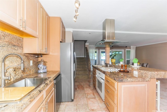 205 Koko Isle Cir Unit 403, Honolulu, HI 96825 - kitchen featuring island exhaust hood, appliances with stainless steel finishes, a sink, light brown cabinets, and decorative backsplash