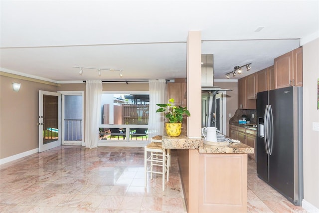 205 Koko Isle Cir Unit 403, Honolulu, HI 96825 - kitchen with stainless steel refrigerator with ice dispenser, track lighting, light marble finish flooring, a kitchen bar, and a peninsula
