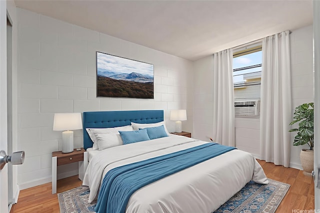 98-1042 Moanalua Rd Unit 2-303, Aiea, HI 96701 - bedroom featuring cooling unit and light wood-style flooring