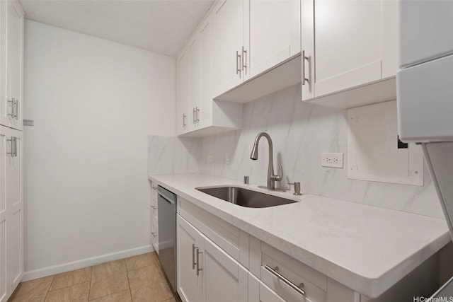 98-1042 Moanalua Rd Unit 2-303, Aiea, HI 96701 - kitchen featuring white cabinetry, light countertops, decorative backsplash, stainless steel dishwasher, and a textured ceiling