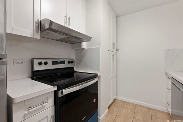 98-1042 Moanalua Rd Unit 2-303, Aiea, HI 96701 - kitchen with appliances with stainless steel finishes, under cabinet range hood, white cabinetry, and light tile patterned flooring