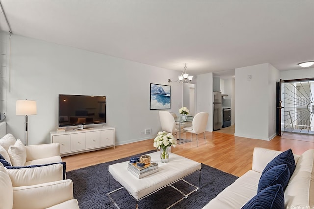 98-1042 Moanalua Rd Unit 2-303, Aiea, HI 96701 - living area with a chandelier and light wood finished floors