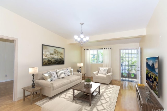 94-1190 Kahuanui St, Waipahu, HI 96797 - living area with a chandelier, light wood-type flooring, and baseboards
