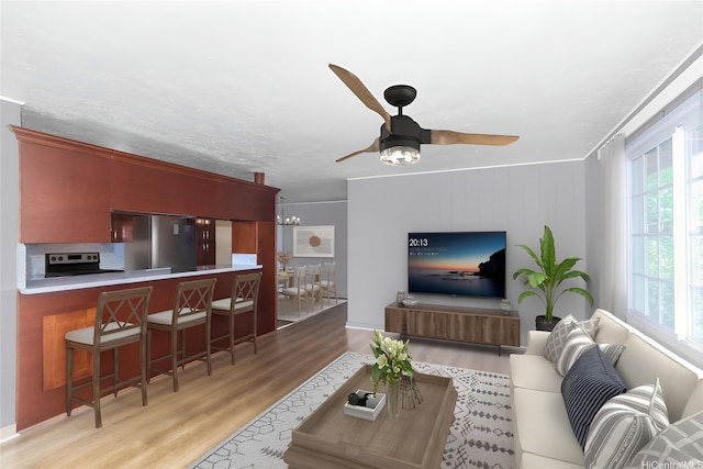94-1190 Kahuanui St, Waipahu, HI 96797 - living room featuring wood finished floors, healthy amount of natural light, a ceiling fan, and a chandelier