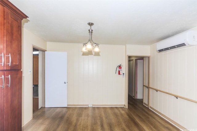 94-1190 Kahuanui St, Waipahu, HI 96797 - spare room with dark wood-style flooring, an AC wall unit, and baseboards