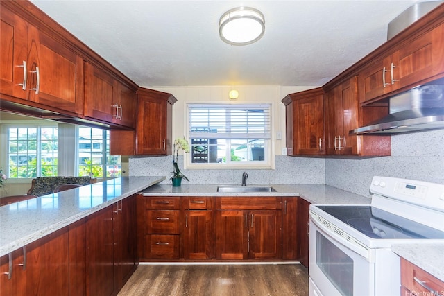 94-1190 Kahuanui St, Waipahu, HI 96797 - kitchen featuring white electric range oven, a sink, under cabinet range hood, dark wood-type flooring, and plenty of natural light