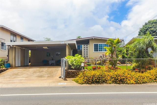 94-1190 Kahuanui St, Waipahu, HI 96797 - view of front facade with a carport and driveway