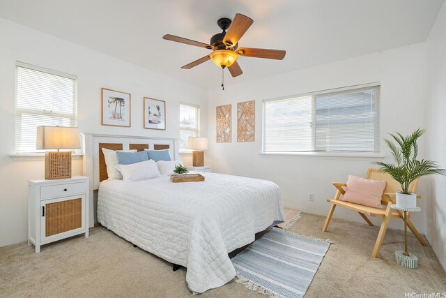 92-7049 Elele St Unit 22, Kapolei, HI 96707 - bedroom featuring light colored carpet, multiple windows, and a ceiling fan