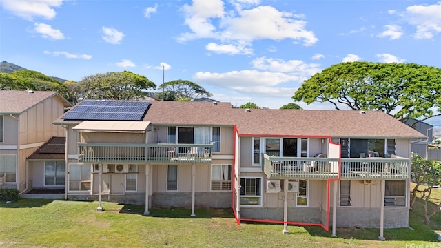 92-1041 Makakilo Dr Unit 82, Kapolei, HI 96707 - back of property with solar panels and a lawn