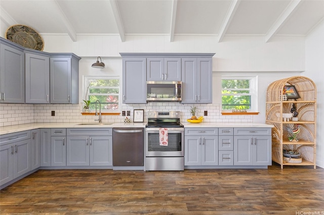 45-173 Kokokahi Pl, Kaneohe, HI 96744 - kitchen featuring appliances with stainless steel finishes, gray cabinets, a sink, beamed ceiling, and decorative backsplash