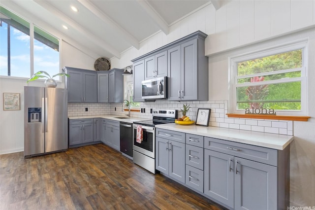 45-173 Kokokahi Pl, Kaneohe, HI 96744 - kitchen featuring appliances with stainless steel finishes, gray cabinets, a sink, backsplash, and light countertops