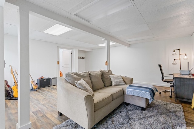 45-173 Kokokahi Pl, Kaneohe, HI 96744 - living room with wood finished floors, a paneled ceiling, and baseboards